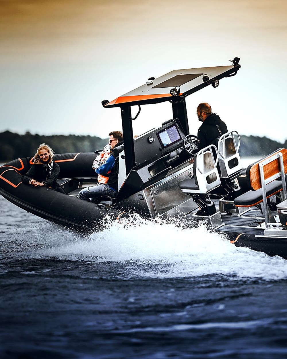 Guests aboard the 750 carving through spray