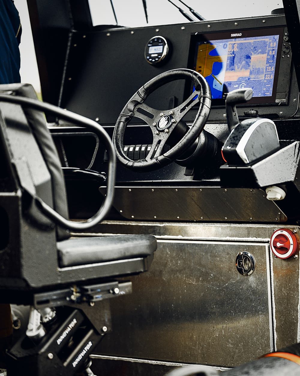 Helm console with wheel, throttle and Simrad chartplotter